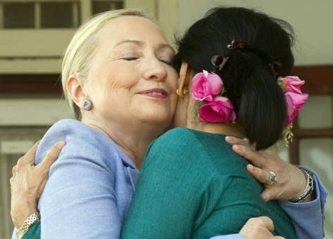 Pro-democracy opposition leader Aung San Suu Kyi and US Secretary of State Hillary Clinton (L) embrace after speaking to the press at Suu Kyi's residence in Yangon on December 2, 2011. Suu Kyi said she was confident about prospects for democratic reforms in Myanmar, after talks with Clinton during a landmark visit