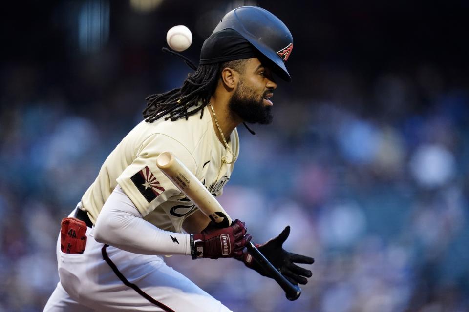 Arizona Diamondbacks' Henry Ramos runs into his own bunt attempt for an out during the third inning of a baseball game against the Los Angeles Dodgers Saturday, Sept. 25, 2021, in Phoenix. (AP Photo/Ross D. Franklin)