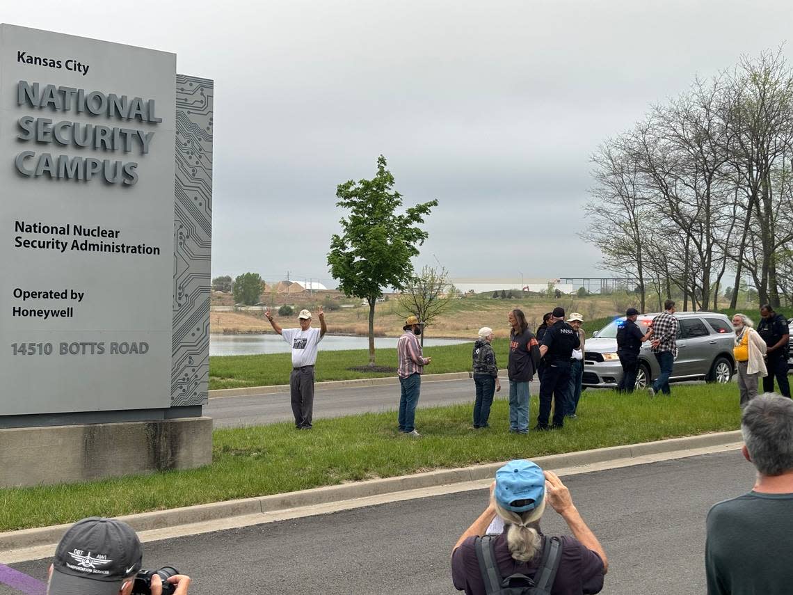 Protesters gather outside the entrance to the National Nuclear Security Administration’s plant in south Kansas City on Monday, April 15, 2024. Police and security officers handcuffed at least 10 people who either ventured onto the expansion site or onto the plant’s land.