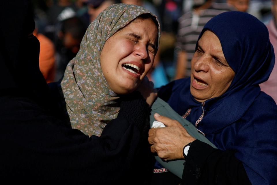 Women mourn during a funeral for Palestinians killed by Israeli strikes in southern Gaza (Reuters)