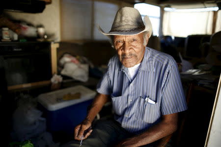 Samuel Cole, 85, poses for a portrait in the motorhome in which he lives on the streets of Los Angeles, California, United States, November 12, 2015. REUTERS/Lucy Nicholson