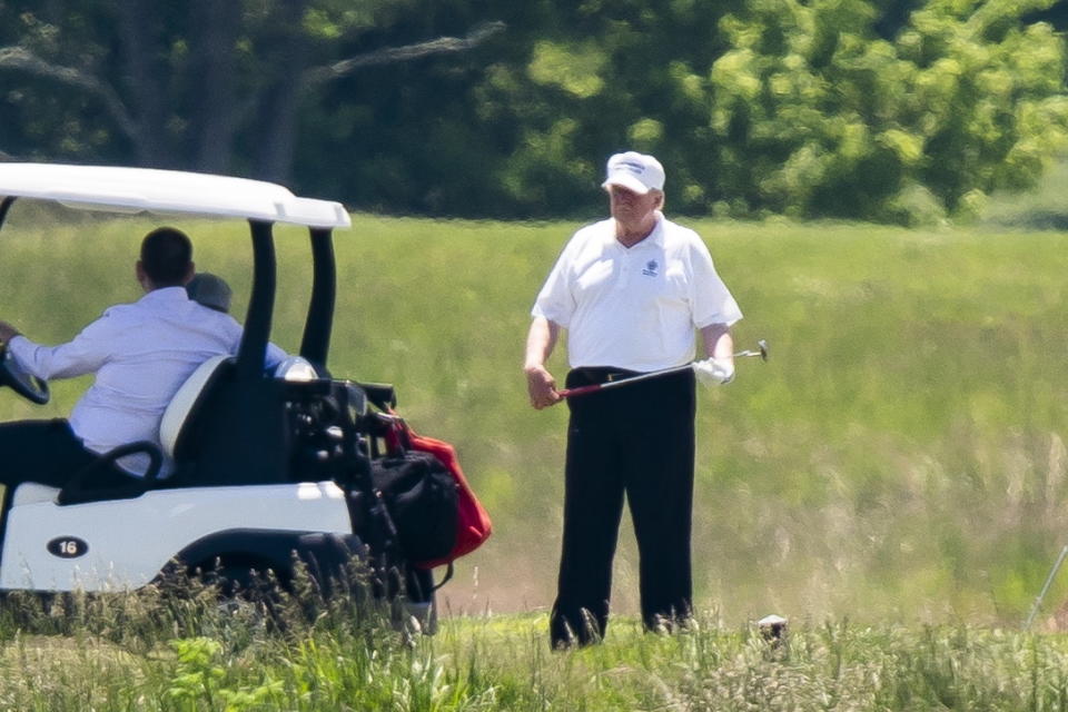 US President Donald Trump plays golf at the Trump National Golf Club in Sterling, Virginia, USA, 23 May 2020. It is the first time the president has played golf since the lockdown over the coronavirus pandemic. Source: EPA