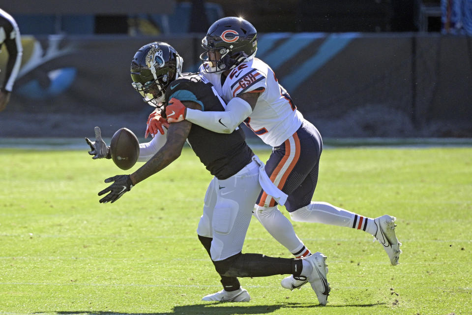 Jacksonville Jaguars wide receiver DJ Chark Jr., left, makes a reception in front of Chicago Bears cornerback Kindle Vildor during the first half of an NFL football game, Sunday, Dec. 27, 2020, in Jacksonville, Fla. (AP Photo/Phelan M. Ebenhack)