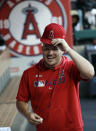 Los Angeles Angels' Mike Trout jokes with teammates in the dugout before the start of a baseball game against the Houston Astros, Monday, July 15, 2019, in Anaheim, Calif. (AP Photo/Marcio Jose Sanchez)