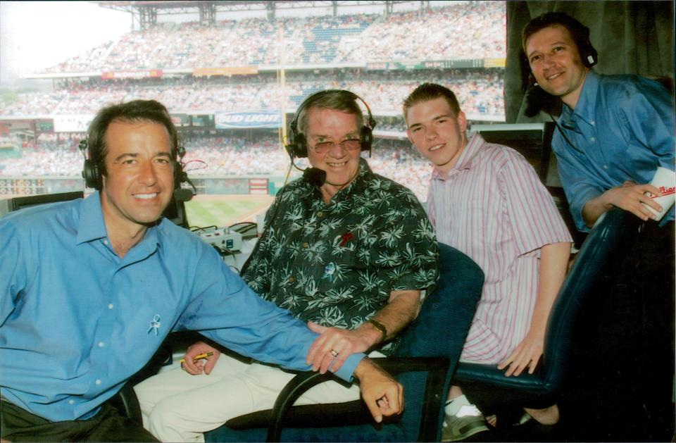 Harry Kalas takes in a ballgame with his three sons Todd, Kane and Brad.