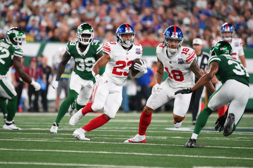 Aug 24, 2024; East Rutherford, New Jersey, USA; New York Giants running back Joshua Kelley (23) runs with the ball against the New York Jets during the first half at MetLife Stadium. Mandatory Credit: Rich Barnes-USA TODAY Sports