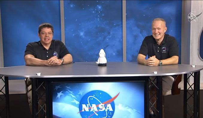 Robert Behnken, left, and Douglas Hurley answer phoned-in questions from reporters during a news conference two days after their historic return to Earth aboard a SpaceX Crew Dragon capsule. / Credit: NASA