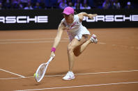 Poland's Iga Swiatek in action during the women's singles semifinal match against Kazakhstan's Elena Rybakina at the WTA Tour in Stuttgart, Germany, Saturday April 20, 2024. (Marijan Murat/dpa via AP)