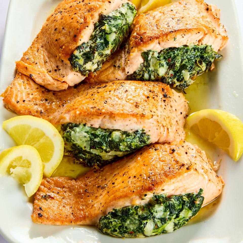 salmon stuffed with creamed spinach with lemons