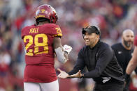 Iowa State head coach Matt Campbell celebrates with running back Breece Hall (28) after Hall's 4-yard touchdown run during the second half of an NCAA college football game against Oklahoma State, Saturday, Oct. 23, 2021, in Ames, Iowa. Iowa State won 24-21. (AP Photo/Charlie Neibergall)