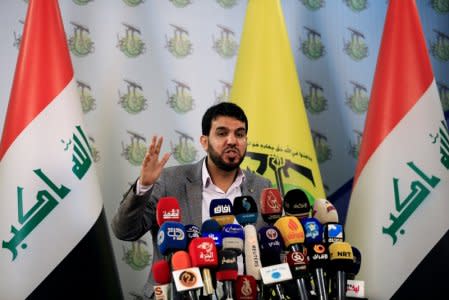 Hashim al-Mousawi, the official spokesman for Harakat Hezbollah al Nujaba, speaks during a news conference in Baghdad, Iraq November 23, 2017. REUTERS/Thaier Al-Sudani