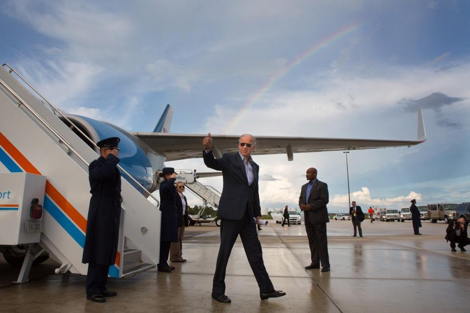 Biden gives a thumbs-up after landing at Southwest Florida International Airport on Sept. 28, 2012.