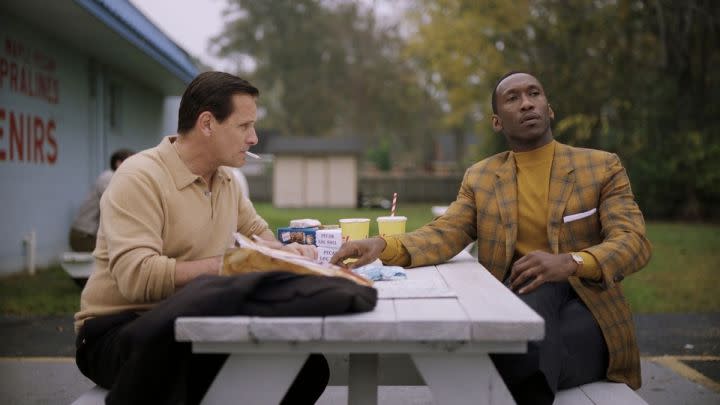 Tony and Don having lunch outside in Green Book.
