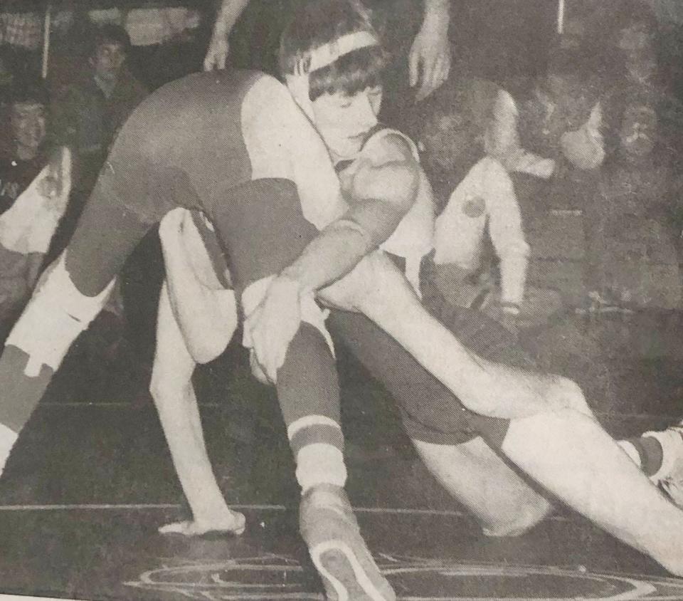 Watertown's Bob Coyle II tries to wrap up Aberdeen Central's Dean Kallas during their 105-pound championship match in the 1987 Region 1A wrestling tournament at Madison. Coyle won by fall.