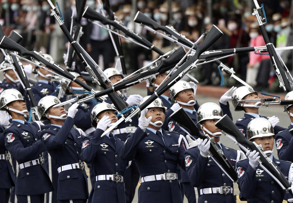 The military honor guard performs during the National Day celebrations in Taipei, Taiwan, Saturday, Oct. 10, 2020. Oct. 10 National Day dates from the start of a 1911 rebellion against the Qing, China's last empire, that led to the establishment of the Republic of China, which remains Taiwan's formal name. (AP Photo/Chiang Ying-ying)