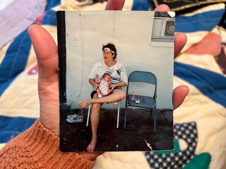 A photo of my birth mother holding me as a newborn, taken on July 4, 1995, in central Florida. I was 11 days old.