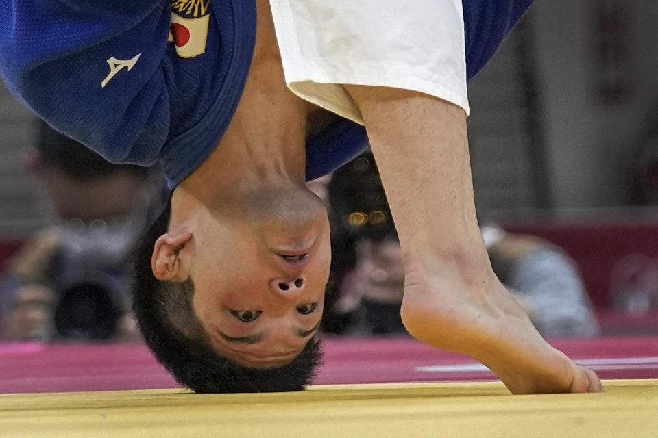 Shohei Ono of Japan, looks as he competes with Alexandru Raicu of Romania during their men's -73kg elimination round of the judo match at the 2020 Summer Olympics in Tokyo, Japan, Monday, July 26, 2021. (AP Photo/Vincent Thian)