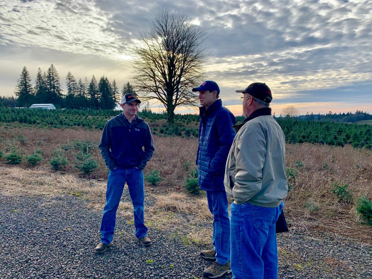 Oregon Sen. Ron Wyden meets with Silver Bells Tree Farm owner Casey Grogan and Oregon Association of Nurseries Executive Director Jeff Stone on Dec. 5, 2021, to discuss issues plaguing the Christmas tree industry due to the effects of the heatwave and drought conditions over the past year.