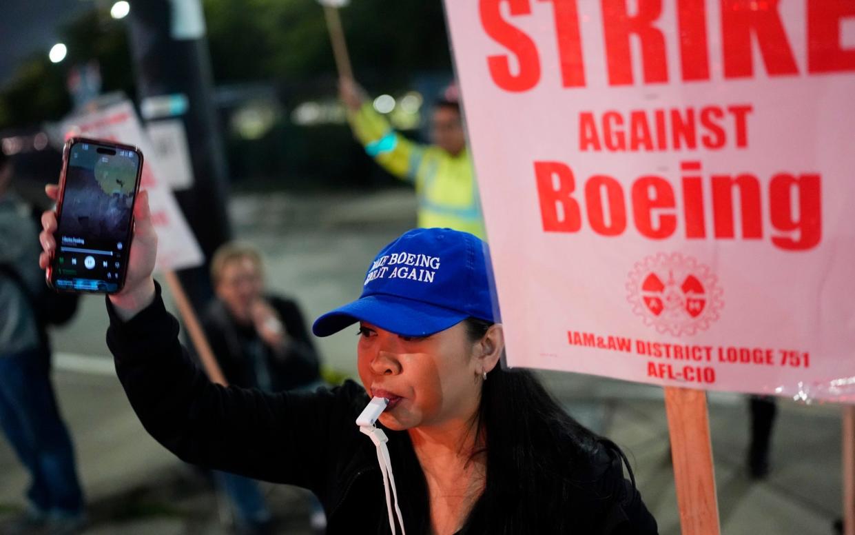 Boeing workers on the US West Coast have voted to go on strike in a dispute over pay