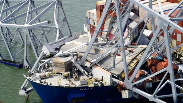 The collapsed Francis Scott Key Bridge and a damaged cargo vessel