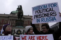 People attend a rally in support of Russia's political prisoners in Belgrade, Serbia, Saturday, Jan. 21, 2023. A friendly, fellow-Slavic nation, Serbia has welcomed the fleeing Russians who need visas to travel to much richer Western European states. But in Serbia, they have not escaped the long reach of Putin's hardline regime influence.(AP Photo/Darko Vojinovic)