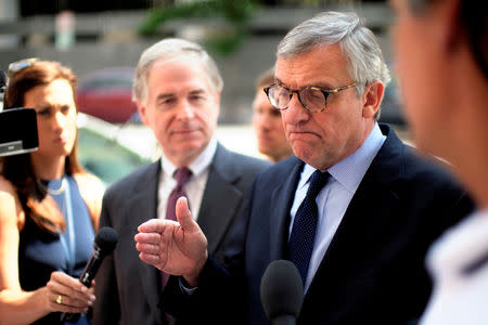 FILE PHOTO: Peter Flaherty (L), Chairman of the National Legal and Policy Center (NLPC), and Paul Kamenar (R), attorney for Roger Stone's associate Andrew Miller, speak to reporters outside U.S. District Court to explain Miller's refusal to appear before a grand jury in Special Counsel Robert Mueller's probe in Washington, U.S., August 10, 2018. REUTERS/James Lawler Duggan/File Photo