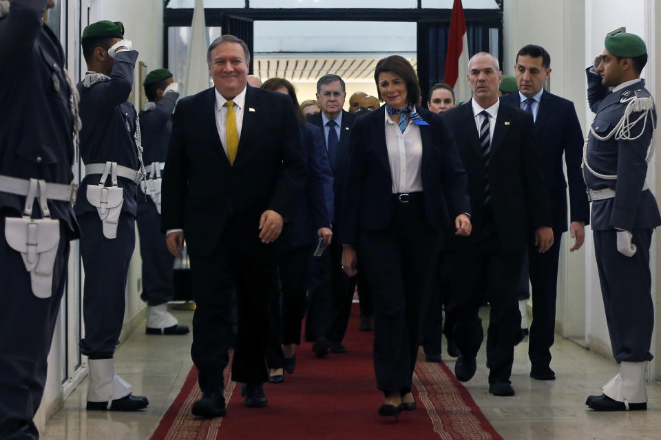 Lebanon's Interior Minister Raya El Hassan, right, walks with U.S. Secretary of State Mike Pompeo, at the interior ministry in Beirut, Lebanon, Friday, March 22, 2019. Pompeo has arrived in Lebanon, the last leg of a Mideast tour that also took him to Kuwait and Israel. (AP Photo/Bilal Hussein)