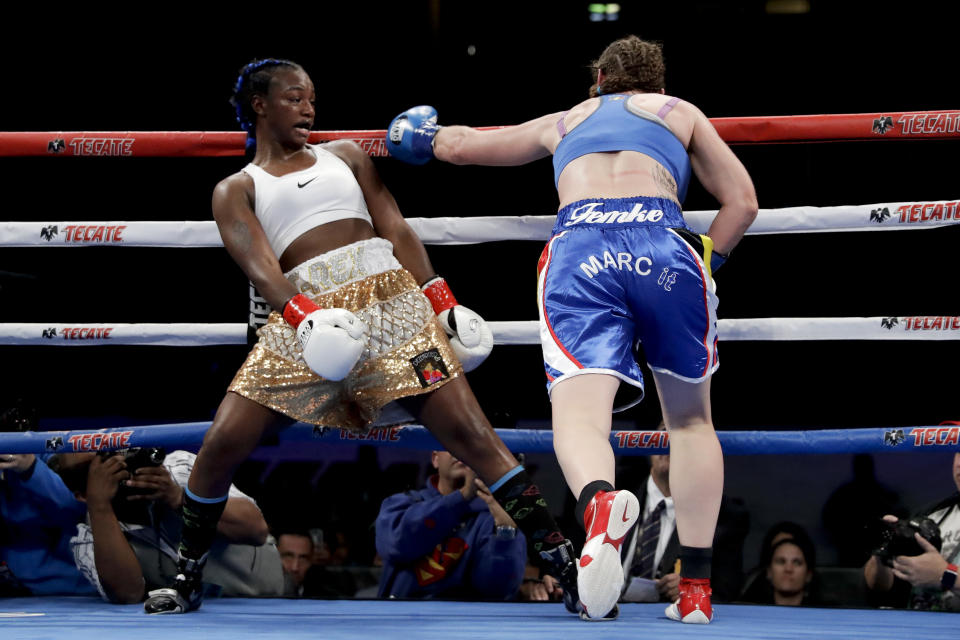 Claressa Shields, left, avoids a punch from Belgium's Femke Hermans, during their WBC/IBF/WBA middleweight title boxing match, Saturday, Dec. 8, 2018, in Carson, Calif. (AP Photo/Chris Carlson)