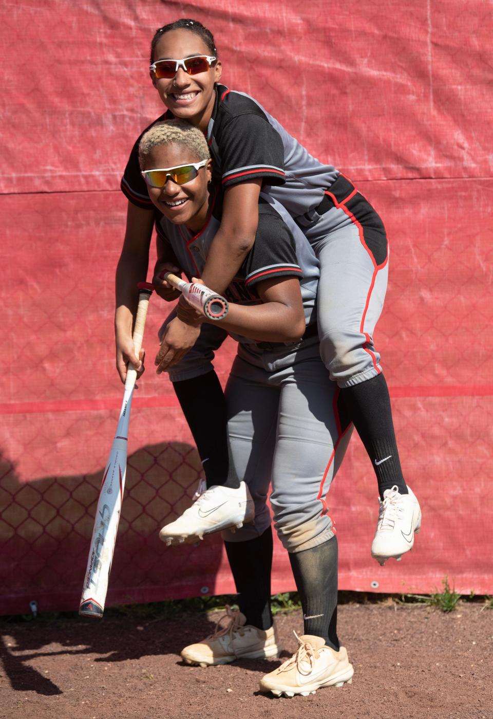 Morgan Harrell-Alvarez, top, and her fraternal twin sister Megan Harrell-Alvarez are members of Vineland High School's varsity softball team.  