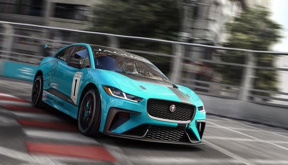 A bright blue Jaguar I-Pace race vehicle, shown on a track.