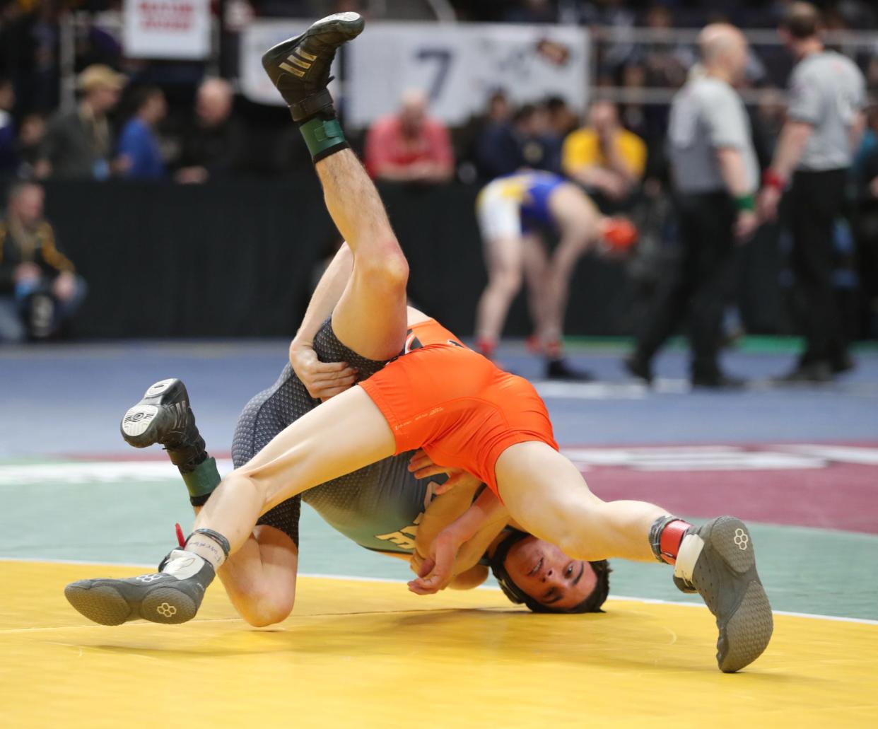 Jackson Wainwright of Our Lady of Lourdes wrestles Daniel Kirsch of Pioneer in a 113-pound match during day 1 of the NYSPHSAA Wrestling Championships at Times-Union Center in Albany on Friday, February 28, 2020.