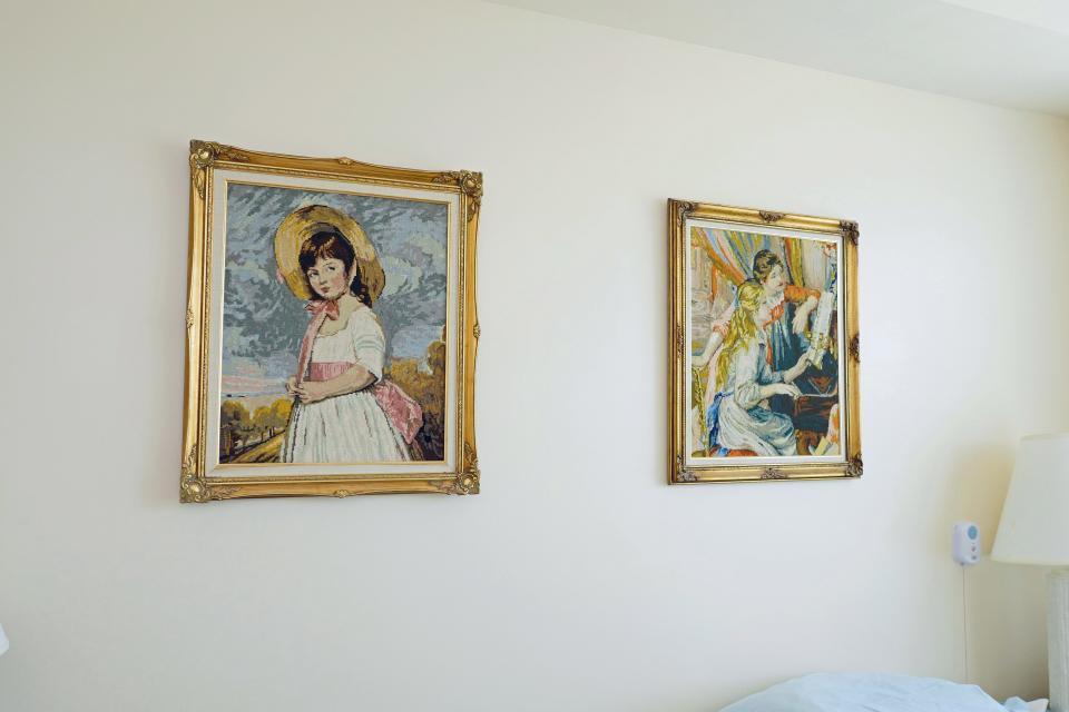Leona Wagner created these two framed needlepoint pictures that are hanging on the wall in the bedroom of their apartment at The Sheridan at Lakewood Ranch.