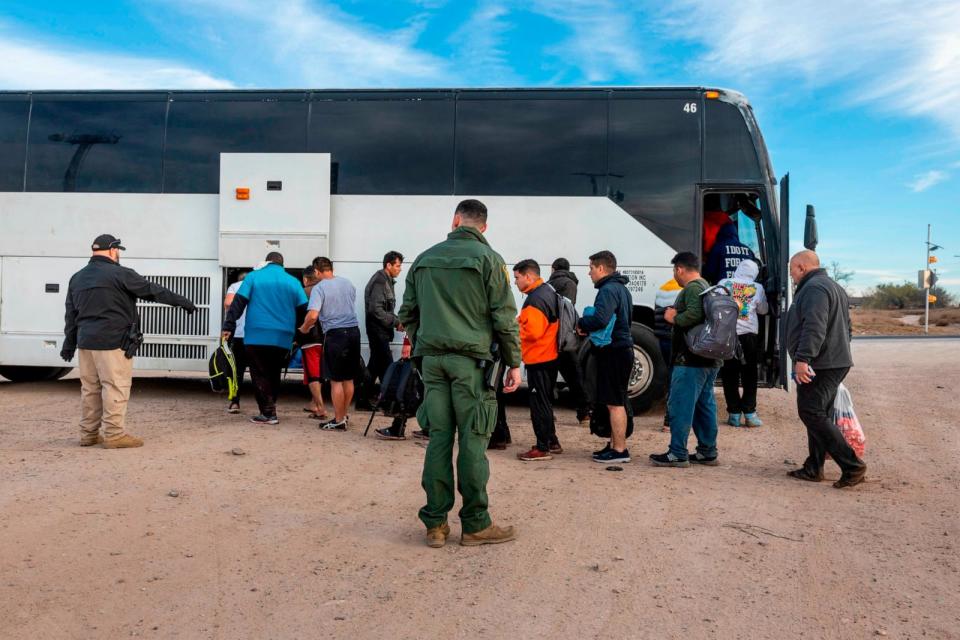 PHOTO: Immigrants file into a U.S. Customs and Border Protection bus after crossing the U.S.-Mexico border January 07, 2024 in Eagle Pass, Texas. (John Moore/Getty Images)