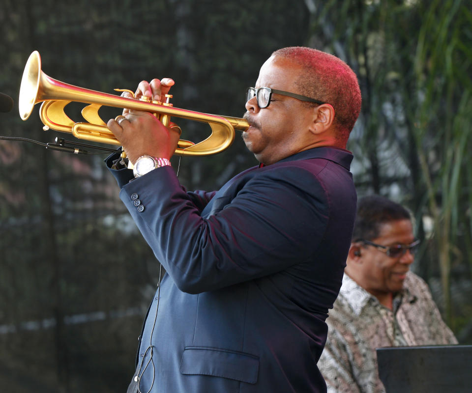 Terence Blanchard, foreground, and Herbie Hancock perform at a sunrise concert marking International Jazz Day in New Orleans, Monday, April 30, 2012. The performance, at Congo Square near the French Quarter, is one of two in the United States that day; the other is in the evening in New York. Thousands of people across the globe are expected to participate in International Jazz Day, including events in Belgium, France, Brazil, Algeria and Russia. (AP Photo/Gerald Herbert)