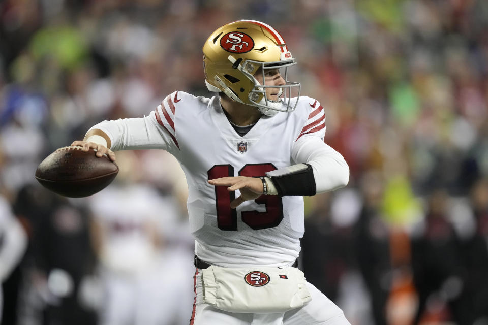 San Francisco 49ers quarterback Brock Purdy passes against the Seattle Seahawks during the first half of an NFL football game in Seattle, Thursday, Dec. 15, 2022. (AP Photo/Stephen Brashear)