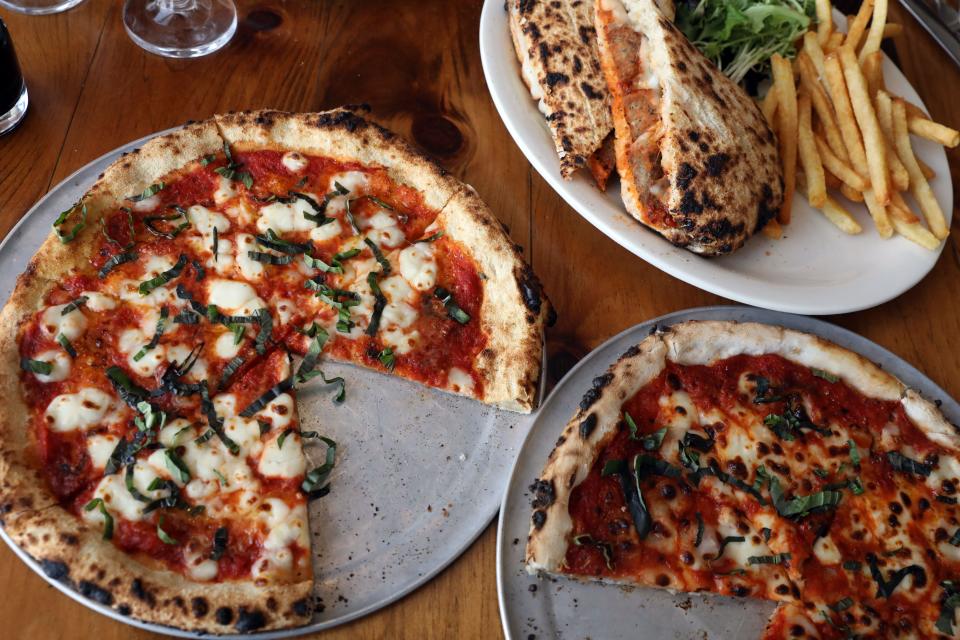 A Margherita pizza, left, a gluten-free version and a meatball panini at Alondra's restaurant in Larchmont Jan. 5, 2024.