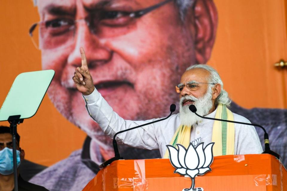 India's Prime Minister Narendra Modi addresses activists and supporters in front of a banner depicting Bihar's chief minister Nitish Kumar during a campaign rally on October 23, 2020.<span class="copyright">Sachin Kumar–AFP/Getty Images</span>