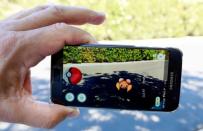 The augmented reality mobile game Pokémon Go by Nintendo is shown on a smartphone screen in this photo illustration. A couple from Kingsville, Ont., south of Windsor, has been fined for playing the game while parked in their vehicle during the COVID-19 lockdown.