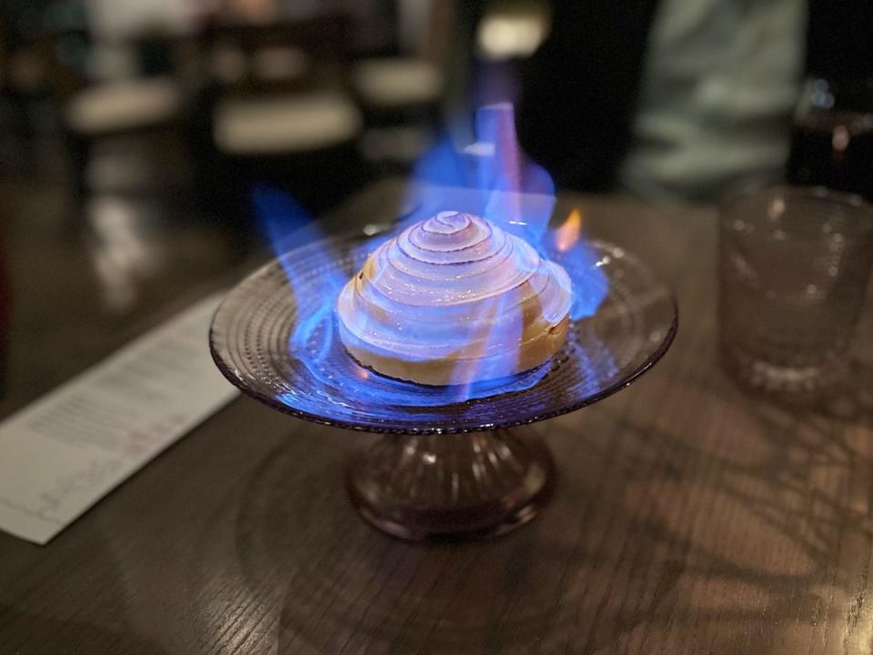 Dessert with a blue flame on it.