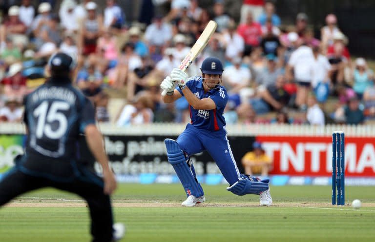 England's Alastair Cook hits a shot during the International One Day Cricket match between New Zealand and England played in Hamilton on Febuary 17, 2013. Captain Brendon McCullum led New Zealand to a dramatic three-wicket win over England with heroic support from an injured Martin Guptill