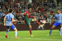 FILE - Portugal's Cristiano Ronaldo, center, challenges for the ball with Spain's Hugo Guillamon, left and his teammate Rodri during the UEFA Nations League soccer match between Portugal and Spain at the Municipal Stadium in Braga, Portugal, Tuesday, Sept. 27, 2022. (AP Photo/Luis Vieira, File)