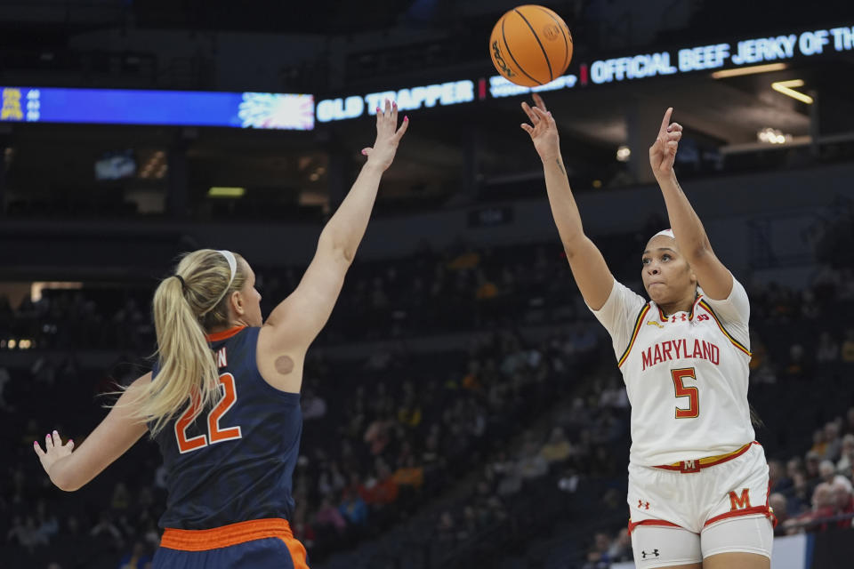 Maryland guard Brinae Alexander (5) shoots over Illinois forward Shay Bollin (22) during the second half of an NCAA college basketball game at the Big Ten women's tournament Thursday, March 7, 2024, in Minneapolis. Maryland beat Illinois 75-65. (AP Photo/Abbie Parr)