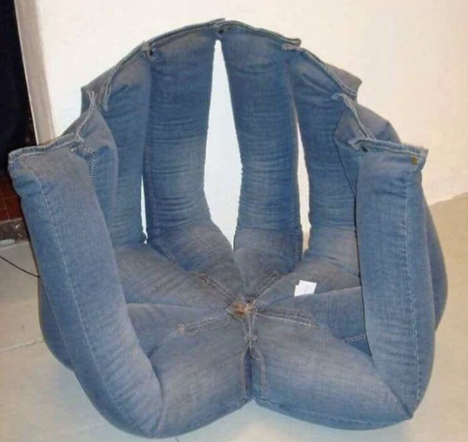 Chair made of several pairs of jeans sewn together to form a unique and artistic piece of furniture with a denim texture