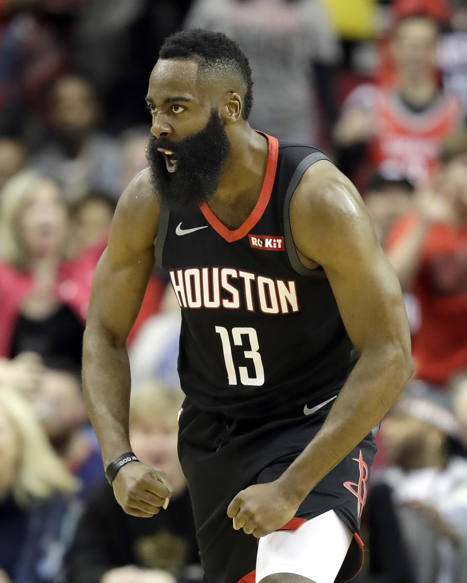 Houston Rockets' James Harden (13) reacts after dunking the ball against the Los Angeles Lakers during the first half of an NBA basketball game Thursday, Dec. 13, 2018, in Houston. (AP Photo/David J. Phillip)