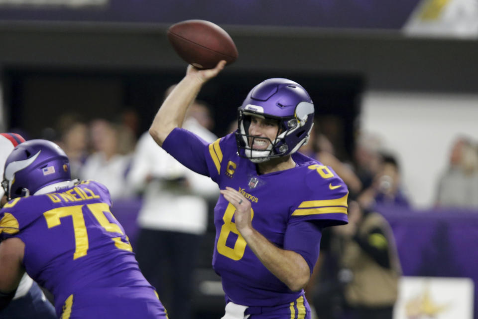 Minnesota Vikings quarterback Kirk Cousins (8) throws a pass during the first half of an NFL football game against the New England Patriots, Thursday, Nov. 24, 2022, in Minneapolis. (AP Photo/Andy Clayton-King)