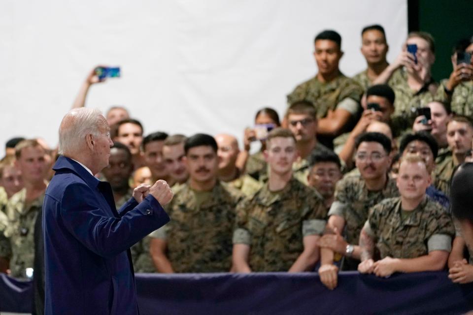 President Joe Biden greets troops upon his arrival at Marine Corps Air Station Iwakuni in Iwakuni, Japan, Thursday, May 18, 2023. Biden made the stop on his way to attend the G-7 Summit in Hiroshima, Japan.