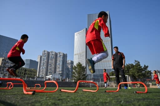 Dong Fangzhuo puts children through a fitness regime during training in Xiamen