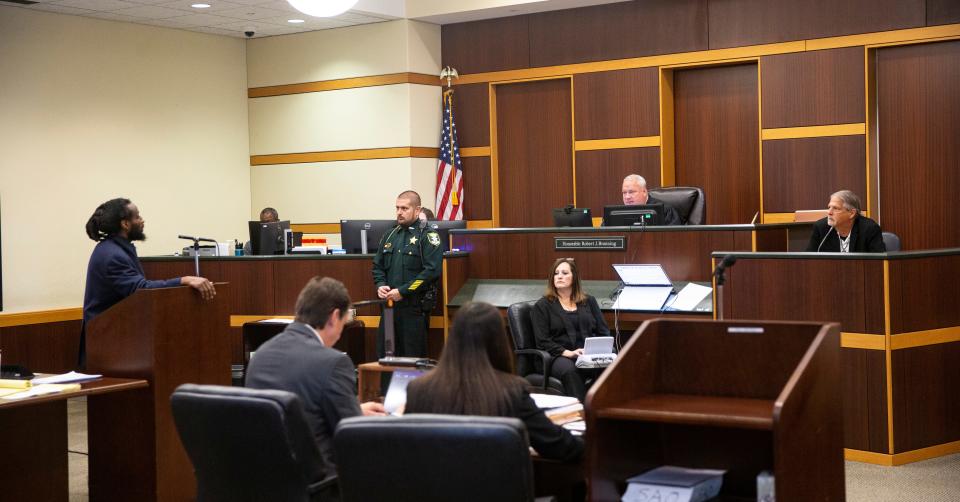 Wisner Desmaret asks questions of David Miller during the penalty phase of his trial on Thursday. Desmaret was found guilty of eight charges including a capital murder offense in the killing of Fort Myers Police officer Adam Jobbers-Miller. The jury is deliberating on whether to recommend life in prison or the death penalty. Miller, who raised robbers-Miller, was giving an impact statement.