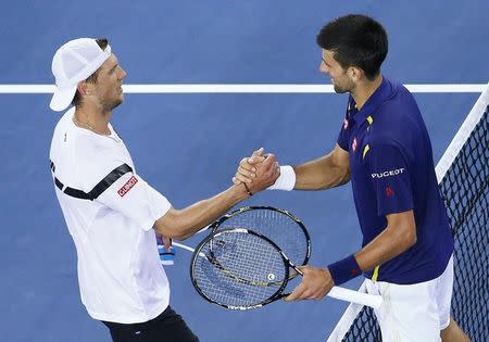 Serbia's Novak Djokovic (R) shakes hands with Italy's Andreas Seppi after Djokovic won their third round match at the Australian Open tennis tournament at Melbourne Park, Australia, January 22, 2016. REUTERS/Jason O'Brien