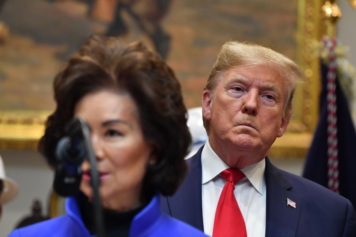 US President Donald Trump listens as Secretary of Transportation Elaine Chao speaks on January 9, 2020